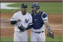  ?? MATT SLOCUM — THE ASSOCIATED PRESS ?? Yankees catcher Gary Sanchez talks on the mound with starting pitcher Luis Severino during Game 3.