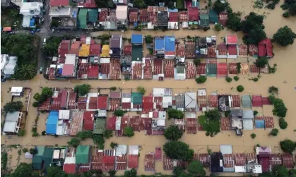  ?? Photograph: AFP/Getty Images ?? A flood-hit area of Ilagan in the Philippine­s after Tropical Storm Nalgae.