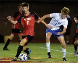  ?? PETE BANNAN — MEDIANEWS GROUP ?? West Chester East’s Owen VanDyke and Great Valley’s Gavin Palmer battle for control of the ball at midfield during Tuesday’s game at Zimmerman Stadium.