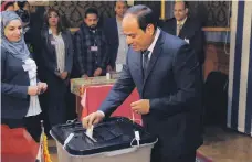  ?? EPA ?? Abdel Fattah El Sisi casts his ballot paper on day one of the presidenti­al elections at a Cairo polling station yesterday