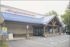  ?? Paul Buckowski / Times Union ?? A customer bought the winning ticket from Minogue’s Beverage in Malta. Wednesday’s Powerball drawing meant a $94 million windfall for the lucky winner, and a $10,000 commission for the store that sold the ticket.