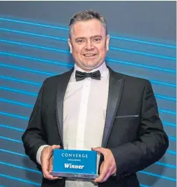  ??  ?? Dr Andrew Woodland won the top award at the Converge Challenge for his company In4Derm.
