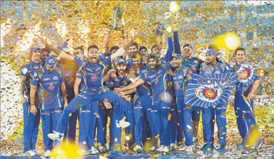  ?? PTI ?? Mumbai Indians players celebrate with the IPL trophy in Hyderabad on Sunday. This is Mumbai’s third IPL triumph, the most by a team.