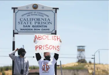  ?? Paul Chinn / The Chronicle ?? Kayla Hunnewell joins a rally demanding protection for inmates of San Quentin State Prison after an outbreak of coronaviru­s exploded in June.