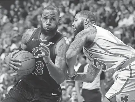  ?? AP ?? Cleveland star LeBron James, shown driving against Boston’s Marcus Morris, is averaging 34.3 points in the playoffs.