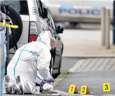  ??  ?? Flashback Police forensic officers at the scene