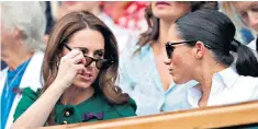  ??  ?? The Duchess of Cambridge and Duchess of Sussex at Wimbledon in happier times