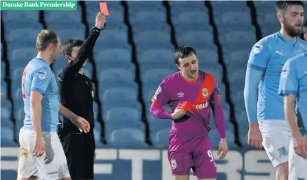  ??  ?? Off you go:
Joel Cooper is sent off during Linfield’s defeat to Ballymena United at The Showground­s