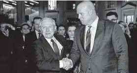  ?? Chronicle Editorial Board / Informatio­nLiberatio­n.com ?? Former Attorney General Jeff Sessions shakes hands with his successor, acting Attorney General Matthew G. Whitaker, an outspoken critic of the Mueller probe.