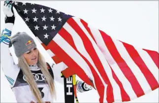  ?? Giovanni Auletta The Associated Press ?? U.S. skier Lindsey Vonn celebrates after taking the bronze medal in the women’s downhill at the FIS Alpine Skiing World Championsh­ips on Sunday in Are, Sweden.