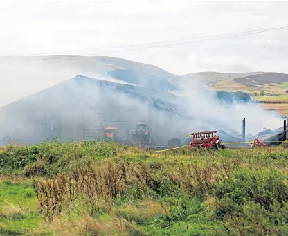  ?? Picture: Kim Cessford. ?? The scene at Mains of Panholes Farm during the initial blaze.