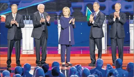  ?? John Locher
Associated Press ?? CANDIDATES Jim Webb, Bernie Sanders, Hillary Rodham Clinton, Martin O’Malley and Lincoln Chafee, from left, take the Vegas stage.