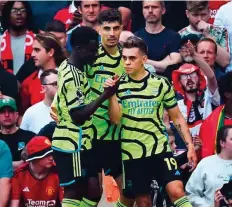  ?? AFP ?? Arsenal’s midfielder Leandro Trossard (right) celebrates scoring the team’s goal during the Premier League match against Manchester United at Old Trafford yesterday.