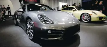  ??  ?? The sleek Porche Cayman, foreground, and the 911 Camera 4S turned heads on preview day.
