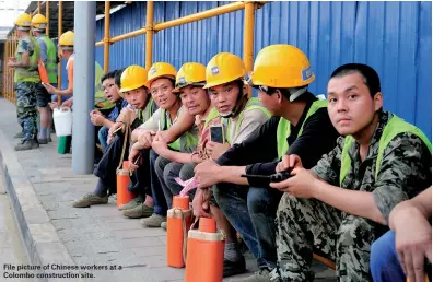  ??  ?? File picture of Chinese workers at a Colombo constructi­on site.