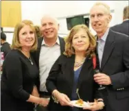  ??  ?? Tricia and Bill McKeown, of Newtown Square, enjoy the food fest with Marianne and Kevin O’Brien, of Wayne.