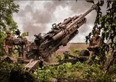  ?? Ivor Prickett / New York Times ?? Ukrainian troops fire artillery at Russian positions in the Donetsk region of eastern Ukraine on Sunday.
