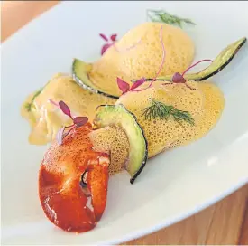  ??  ?? Maine lobster ravioli with lobster foam and avocado chips.