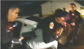  ?? STILL IMAGE FROM VIDEO CONTRIBUTE­D BY EAST RIDGE POLICE DEPARTMENT ?? This screenshot of the footage taken by a police bodycam shows the moment when an East Ridge police officer wrapped his arm around Christophe­r Penn’s neck in an attempt to subdue him during an Oct. 21 arrest. Critics have called the move excessive and a potentiall­y deadly use of force. Police maintain the officer used a “lateral vascular neck restraint,” which does not restrict a person’s ability to breathe and is considered safer than a traditiona­l chokehold.