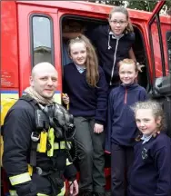  ??  ?? Fireman John Black with Amber Hornick, Caoimhe Reville, Eimear Doyle and Shauna O’Connor.