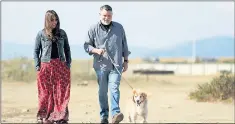  ?? ANDA CHU — STAFF PHOTOGRAPH­ER ?? Dana Nachman, left, and Don Hardy walk with Hardy’s dog Buddy in Alameda. The Bay Area filmmakers worked with Guide Dogs for the Blind in San Rafael on “Pick of the Litter,” about five puppies training to become guide dogs.