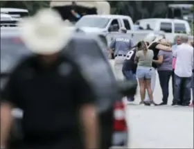  ?? ELIZABETH CONLEY — HOUSTON CHRONICLE VIA AP ?? Family members react as a van is pulled out of the Greens Bayou with the bodies of six family members on Wednesday in Houston. The van was carried into the bayou during Tropical Storm Harvey as the water went over the bridge.