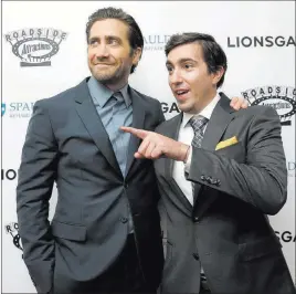  ?? Stevensenn­e ?? The Associated Press Boston Marathon bombing survivor Jeff Bauman, right, walks the red carpet with actor Jake Gyllenhaal last week at the U.S. premiere of “Stronger” in Boston.