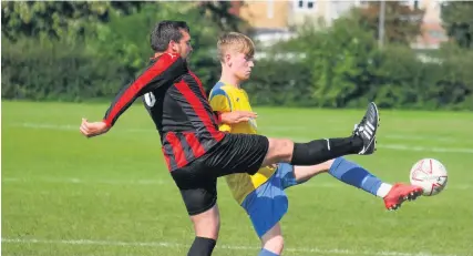  ??  ?? A Seymour United player gets to the ball ahead of his Shaftesbur­y Crusade opponent during last Saturday’s Bristol Premier Combinatio­n game, which Seymour won 1-0