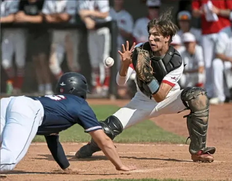  ?? Barry Reeger/ For the Post-Gazette ?? West Allegheny catcher Will Gubba receives the throw in time to tag out Shaler runner Luke Beran in a WPIAL Class 5A quarterfin­al game Thursday. West Allegheny defeated Shaler, 7-6.