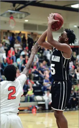  ??  ?? Markeion Jones shoots over LaFayette’s Tyrese Hunter during Friday’s county showdown in LaFayette. Jones hit six 3-pointers and finished with 26 points as the Panthers beat the Ramblers, 59-47. (Messenger photo/Scott Herpst)