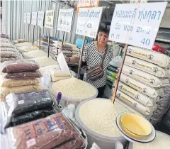  ?? ROJJANAMET­AKUN SEKSAN ?? Hom mali rice from famous growing areas is available at a market in Bangkok.