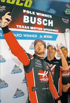  ?? Matt Sullivan/Getty Images ?? Kurt Busch, left, takes a selfie with his team after qualifying Friday in the pole position.