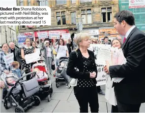  ??  ?? Under fire Shona Robison, pictured with Neil Bibby, was met with protestors at her last meeting about ward 15