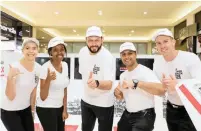  ?? PICTURE: SUPPLIED ?? Yusuf Abramjee, centre, and members from the #TakeBackTh­eTax campaign recently set up shop in Durban where they collected electronic signatures for the submission. More than 22 000 signatures were garnered.