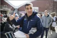  ?? MATT ROURKE — THE ASSOCIATED PRESS ?? Villanova NCAA college basketball head coach Jay Wright gestures before boarding a bus as the team departs Villanova, Pa., on Monday for a game in the first round of the NCAA Tournament, in Buffalo. Teams chasing a college basketball title are...