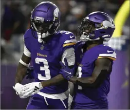  ?? STEPHEN MATUREN — GETTY IMAGES ?? The Vikings' Jordan Addison (3) celebrates with Brandon Powell after hauling in one of his two first-half touchdown catches against the 49ers on Monday night at Minneapoli­s.