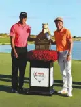  ?? Associated Press ?? Rickie Fowler, right, poses with Tiger Woods and the trophy after Fowler won the Hero World Challenge golf tournament Sunday at Albany Golf Club in Nassau, Bahamas.