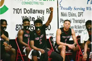  ?? (Pine Bluff Commercial/I.C. Murrell) ?? Pine Bluff senior Jalen Tatum (2) signals a play from the bench as Tyric Stewart (5) and Eric Adams (1) watch toward the end of Friday’s victory at White Hall.