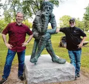  ?? Ned Gerard/Hearst Connecticu­t Media ?? Tom Evans and Jim Warren pose next to a statue commonly referred to as “the thinker” on the grounds of the former American Shakespear­e Theater, in Stratford, Conn.