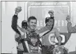  ?? CARLOS OSORIO/AP PHOTO ?? Kyle Larson raises his arms after winning the NASCAR FireKeeper­s Casino 400 on Sunday at Brooklyn, Mich.