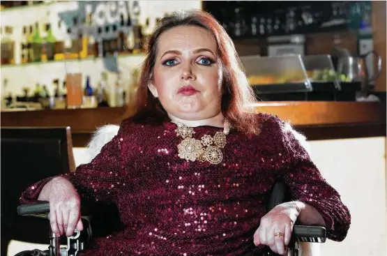  ?? Yi-Chin Lee / Houston Chronicle ?? “I’m not supposed to be here, but I am,” former Ms. Wheelchair Texas Pageant contestant and model Deborah Grayson Carpenter says of beating her life expectancy.