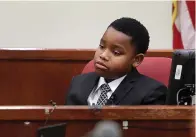  ?? (Amanda McCoy/Star-Telegram via AP, Pool) ?? Zion Carr, 11, testifies during the murder trial of former Fort Worth Police Officer Aaron Dean on Monday in Fort Worth, Texas. Zion is Atatiana Jefferson’s nephew and was present when she was shot and killed by Dean through a window in her own Fort Worth home in 2019.