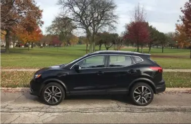  ?? (Robert Duffer/Chicago Tribune/TNS) ?? 2018.5 Nissan Rogue Sport in AWD in SL trim is a smaller, less efficient version of the best-selling Rogue crossover. It’s powered by a 141-hp 4-cylinder engine with a CVT in AWD.