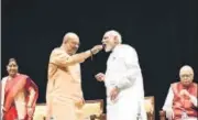  ?? ARVIND YADAV/HT PHOTO ?? BJP president Amit Shah offers sweets to Prime Minister Narendra Modi at the party’s parliament­ary party meeting in New Delhi on Tuesday.