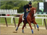  ?? PETER MORGAN - THE ASSOCIATED PRESS ?? Triple Crown hopeful Justify gallops around the track during a workout at Belmont Park, Thursday, June 7, 2018, in Belmont, N.Y.