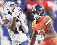  ?? Matthew Stockman / Getty Images ?? The Bills’ Stefon Diggs makes a reception past the Broncos’ De’Vante Bausby on Dec. 19.