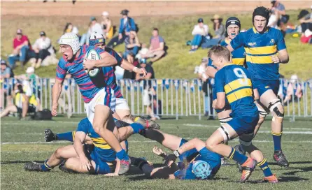  ?? Picture: Nev Madsen ?? CUP MAGIC: Downlands’ Mac Grealy won the O’Callaghan Cup for his side with one the cup’s greatest ever tries in 2019.