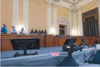  ?? PHOTO BY J. SCOTT APPLEWHITE OF THE ASSOCIATED PRESS ?? Television crews and technician­s prepare the Cannon Caucus Room for Thursday night’s hearing by the House select committee investigat­ing the attack of Jan. 6, 2021, at the Capitol in Washington.