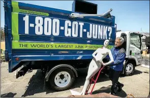  ?? AP/DAMIAN DOVARGANES ?? James Williams, owner of a 1-800-GOT JUNK franchise in Burbank, Calif., says he gains work cleaning out closed stores but he also loses a regular customer at the same time..