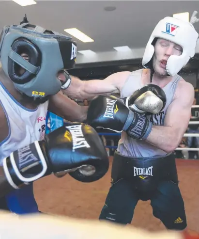  ?? WHACKED: Jeff Horn, right, sparring with Ray Robinson yesterday ahead of his fight with Terence Crawford. ??